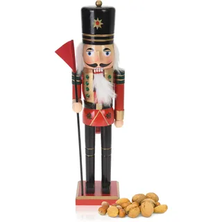 com-four® Dekofigur Nussknacker mit roter Fahne - Weihnachtsdeko in Form eines traditionellen Nussknackers - Deko-Nussknacker im klassischen Design