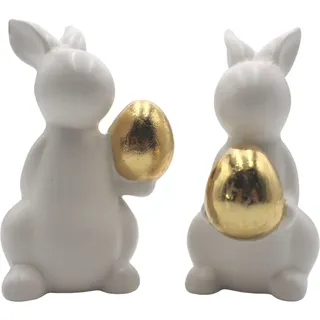 Dekohelden24 Hasen in weiß mit goldenem Ei im 2er Set, Keramik, Osterdeko, Osterhase, Größe: L/B/H 7 x 8 x 14 cm