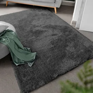 -luxor- living moderner Hochflor Teppich Gela, Kunstfell Optik, Shaggy Teppich geeignet als Teppich Wohnzimmer oder Badezimmerteppich, unifarben 133 x 190 cm Anthrazit